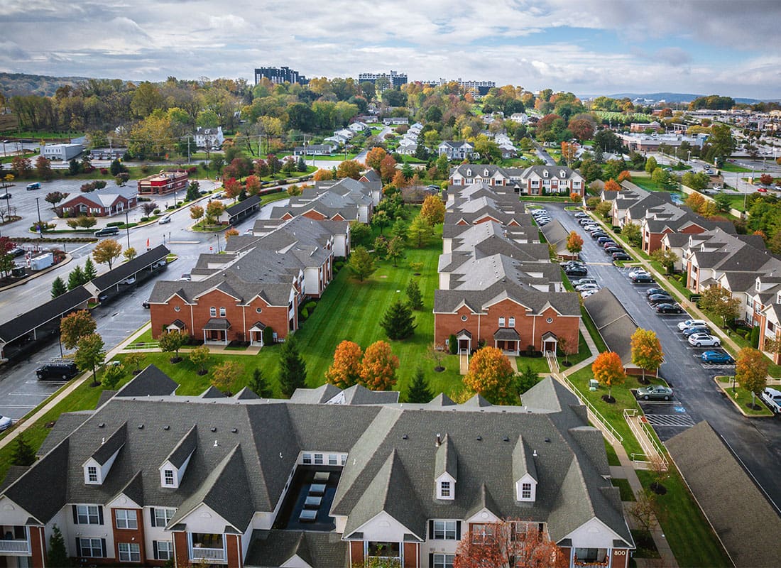 Insurance Solutions - Aerial View of Condo Units on Green Grass in King of Prussia Pennsylvania During the Fall